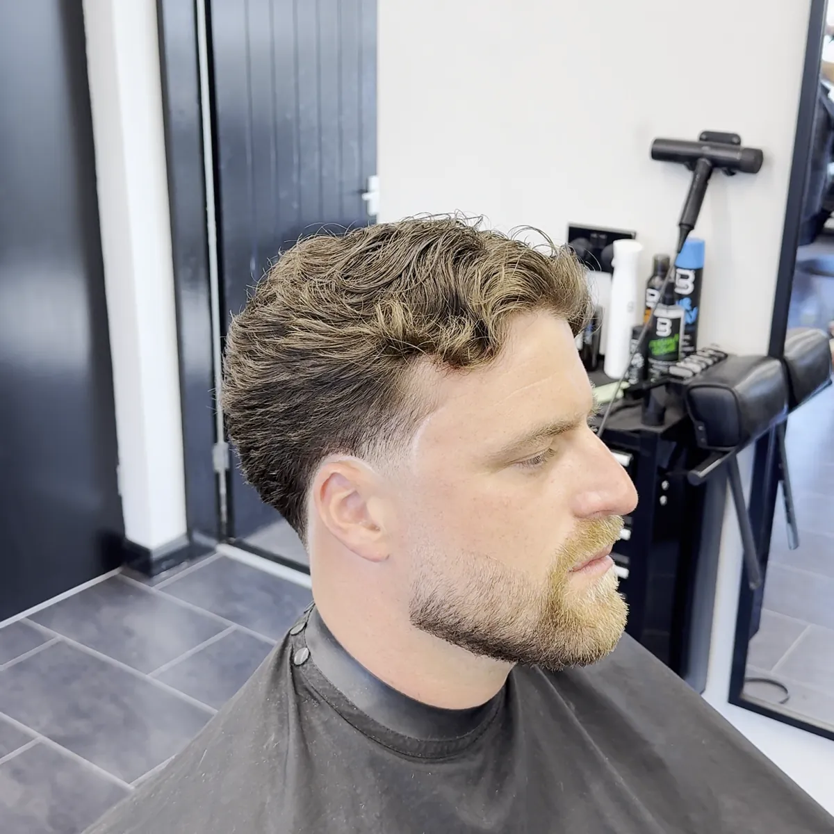 Curly top with a faded side